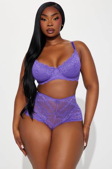 a woman in a purple lingerie