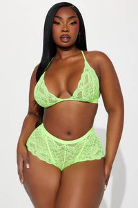 a woman in a neon green lingerie