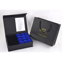 a black box with blue roses inside of it