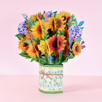 a vase filled with lots of colorful flowers