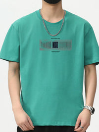 Men's plus size round neck teal T-shirt with graphic print, short sleeves, and a relaxed fit.