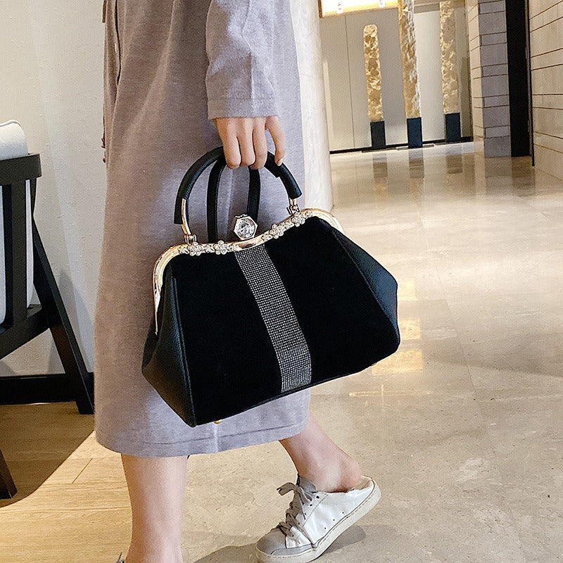 Luxurious Women's Handheld Diamond Bag in elegant setting, perfect for sophisticated weddings and versatile occasions.