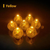 a group of yellow lights sitting on top of a table