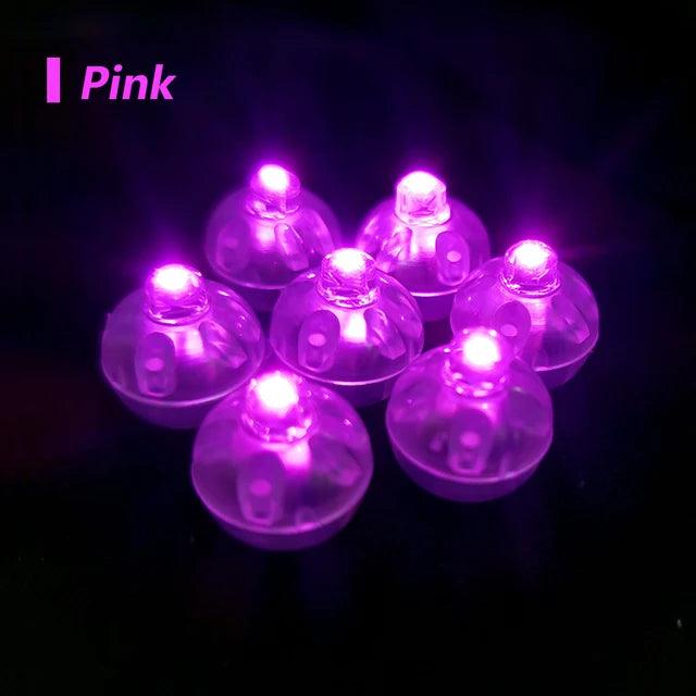 a group of purple lights sitting on top of a table