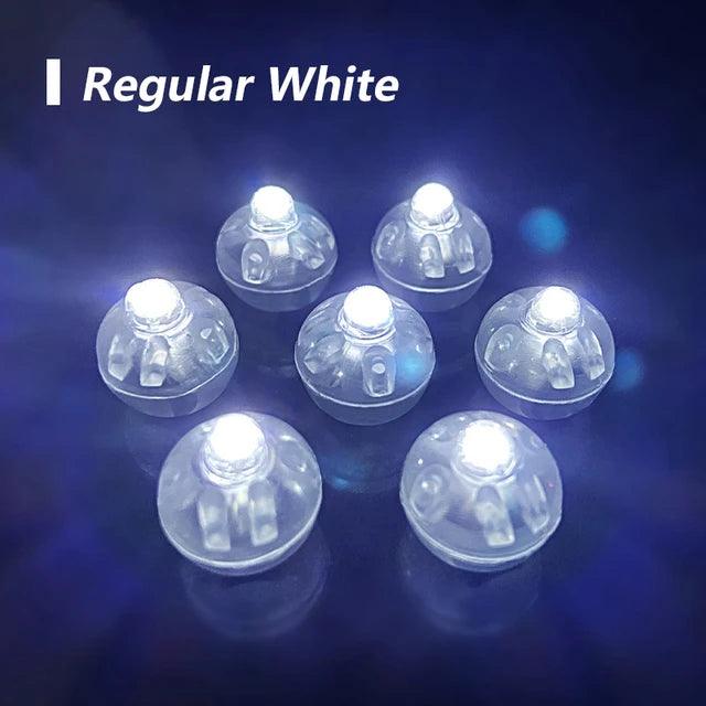a set of six clear round lights on a black background