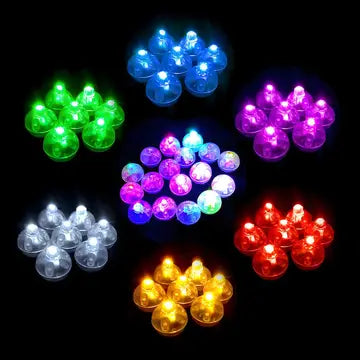 a bunch of different colored lights on a black background