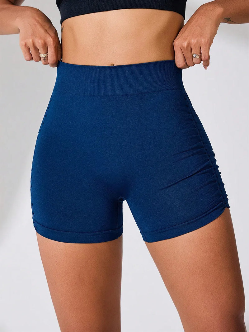 Side ruched high rise active shorts in navy blue, featuring stretchy fabric for comfort.