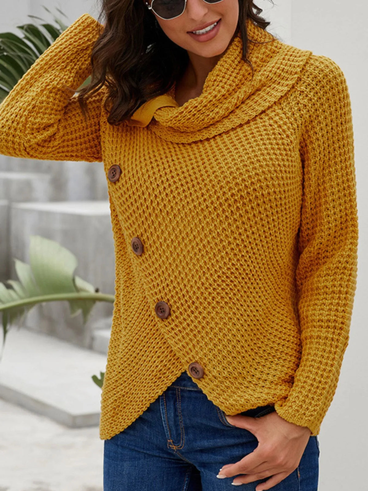 Full size textured turtleneck long sleeve sweater in mustard yellow with decorative buttons, styled with jeans.