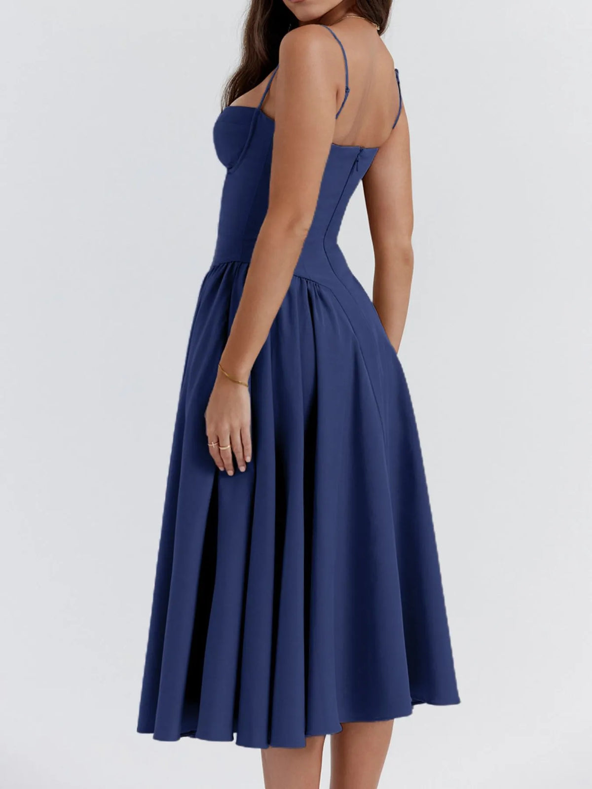 Ruched sweetheart neck cami dress in navy, showcasing a fitted bodice and flowing skirt from the back view.