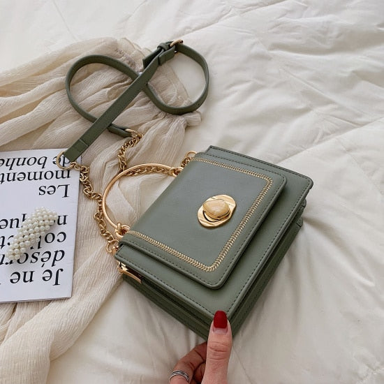 Elegant green leather mini crossbody bag with gold accents, perfect for luxurious weddings and everyday use.