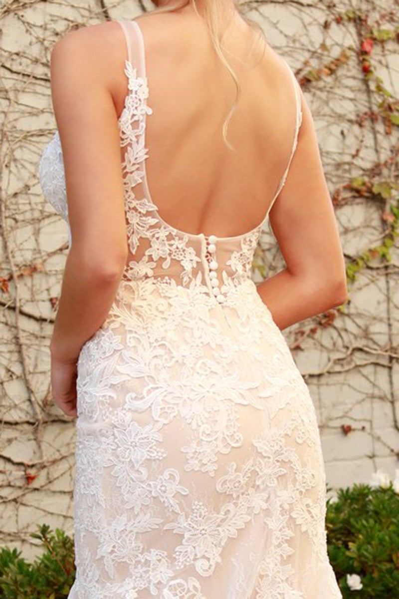 a woman in a wedding dress looking back