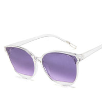 Sunglasses with clear frames and purple lenses, perfect for ladies' formal wear & accessories NZ.