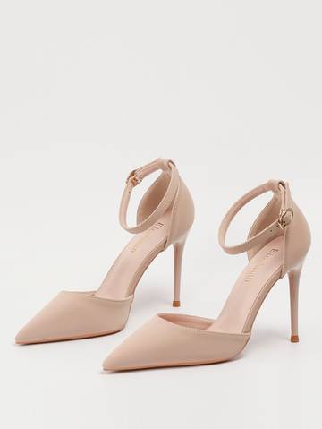a pair of nude colored high heels