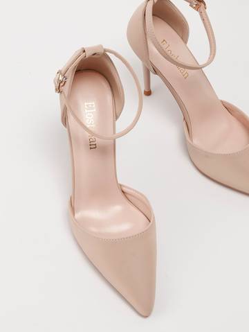 a pair of nude colored high heels