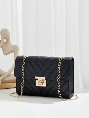 a black purse sitting on top of a table