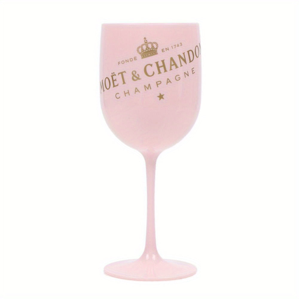 a pink wine glass with a crown on it
