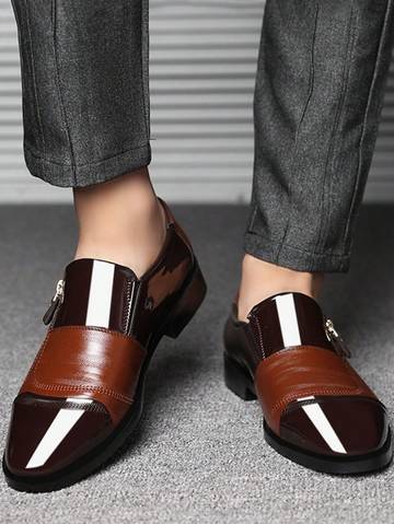 a person wearing a brown and brown loafer