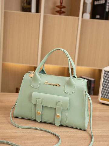 a light green purse sitting on top of a table