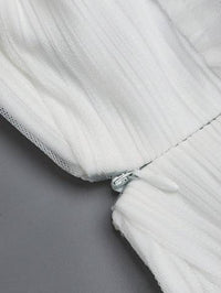 a close up of a white jacket with a zipper