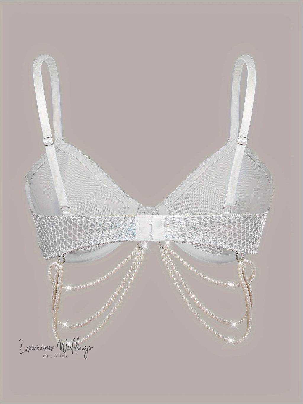 a white bra with pearls attached to it