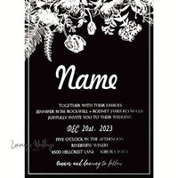 a black and white wedding card with flowers