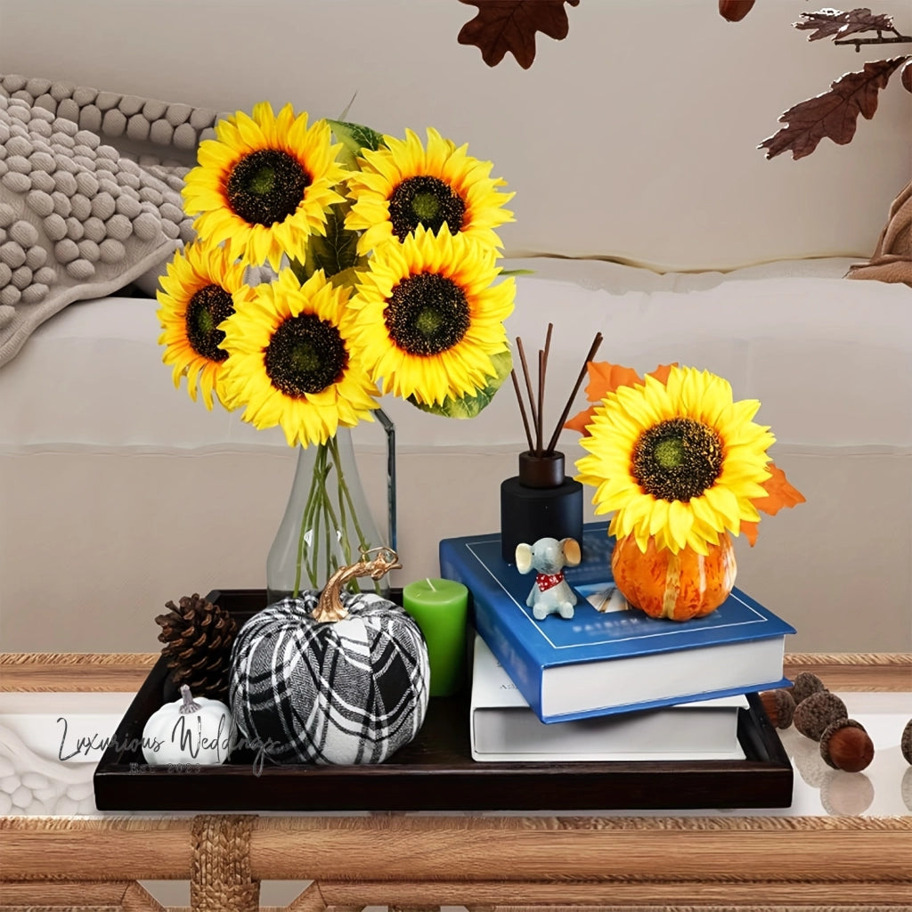 a table topped with a vase filled with sunflowers