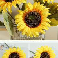 a vase filled with yellow sunflowers on top of a table