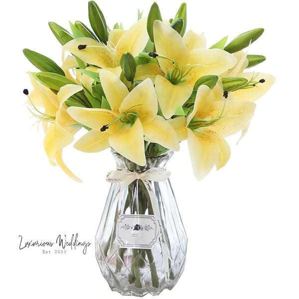 a vase filled with yellow flowers on top of a table