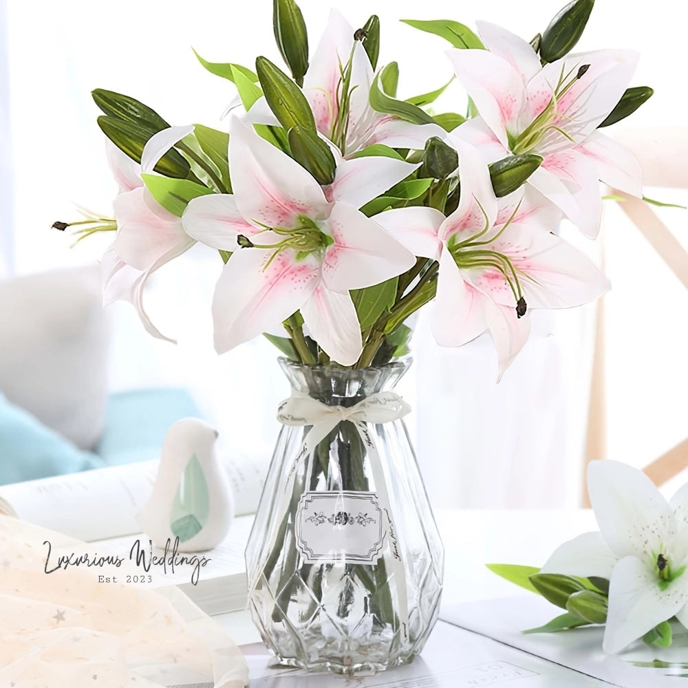 a glass vase filled with pink and white flowers