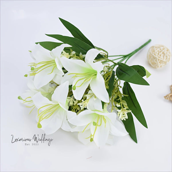 a bouquet of white flowers sitting on top of a table