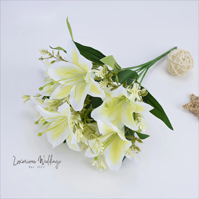 a bouquet of white flowers sitting on top of a table