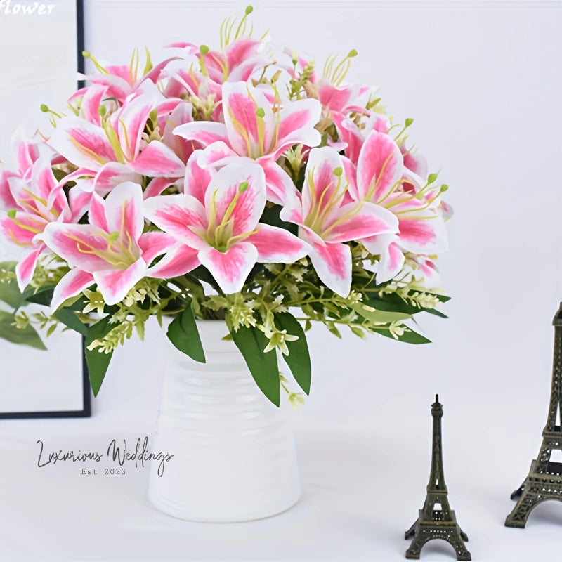 a vase of pink flowers next to a miniature eiffel tower