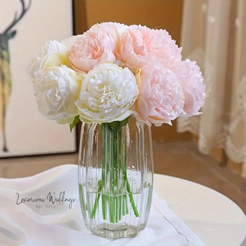 a vase filled with pink and white flowers