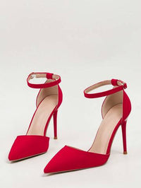 a pair of red high heeled shoes on a white background