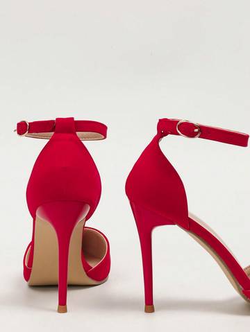 a pair of red high heeled shoes on a white background