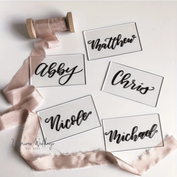 a group of name tags on a white surface