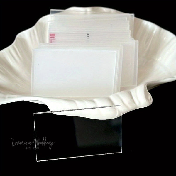 a stack of white cards sitting on top of a white plate