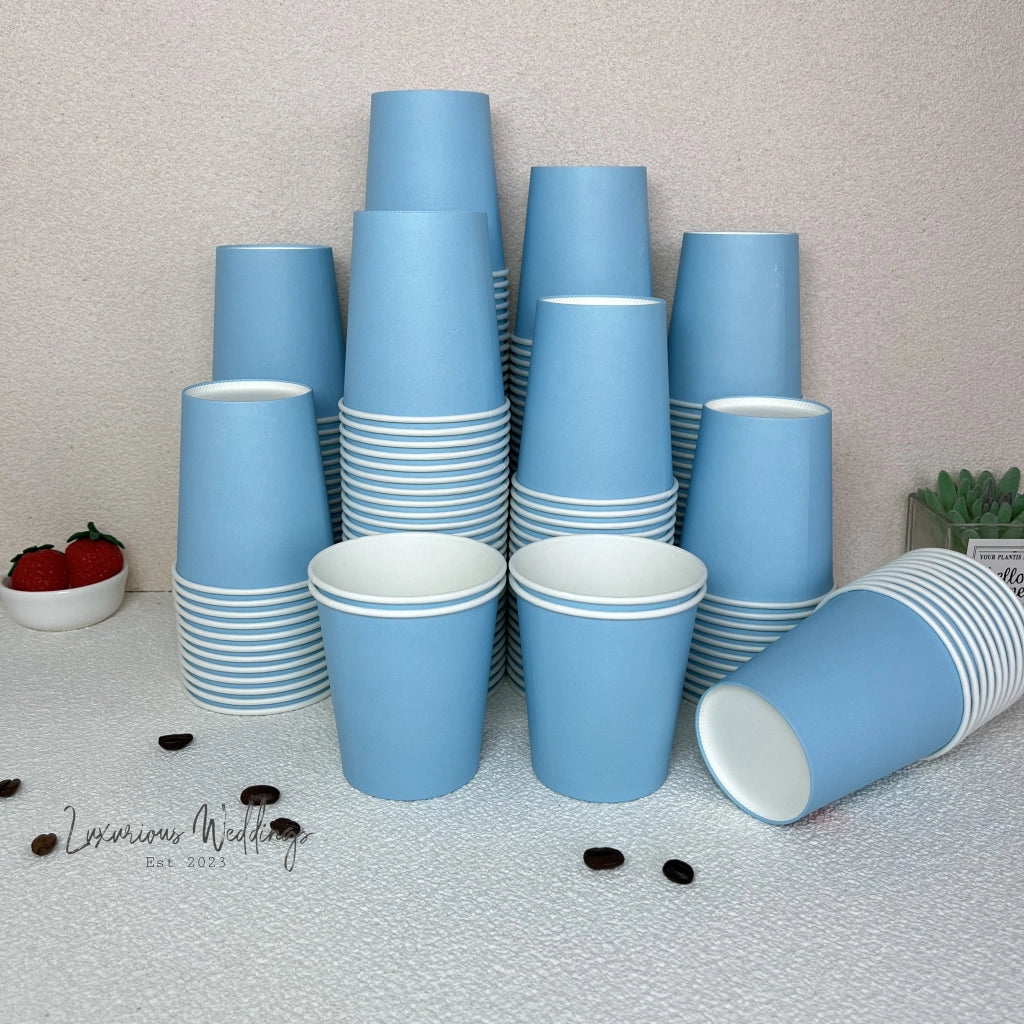 a stack of blue cups sitting on top of a table