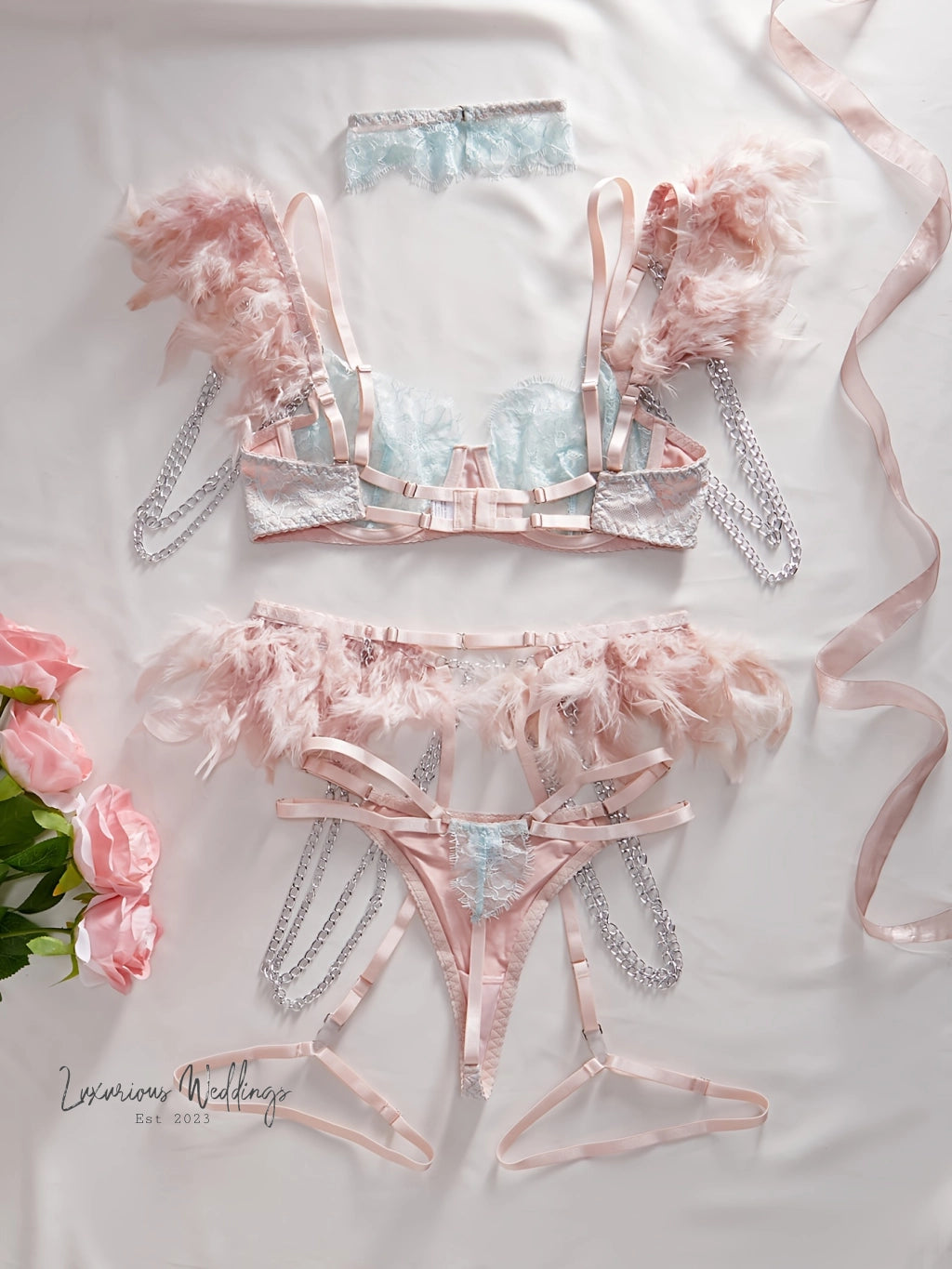 two pieces of lingerie on a bed with pink flowers