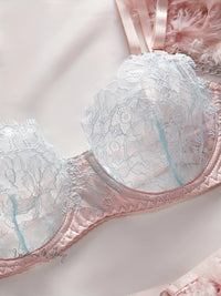 a close up of a bra on a bed