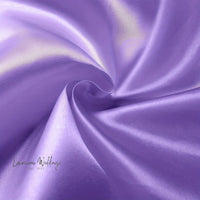 a close up of a purple satin fabric