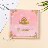 a pink card with a gold crown on it