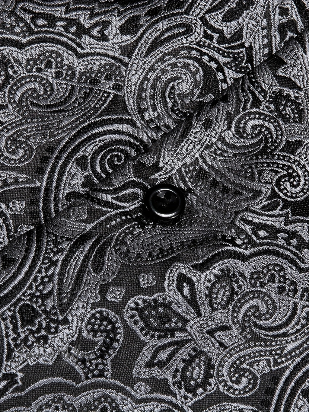 a close up of a black and white paisley pattern
