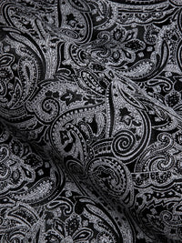 a close up of a black and white paisley print fabric