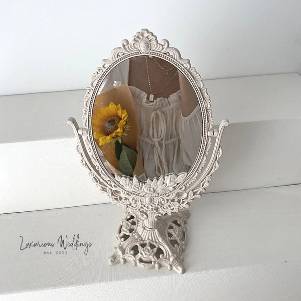 a mirror that has a sunflower in it