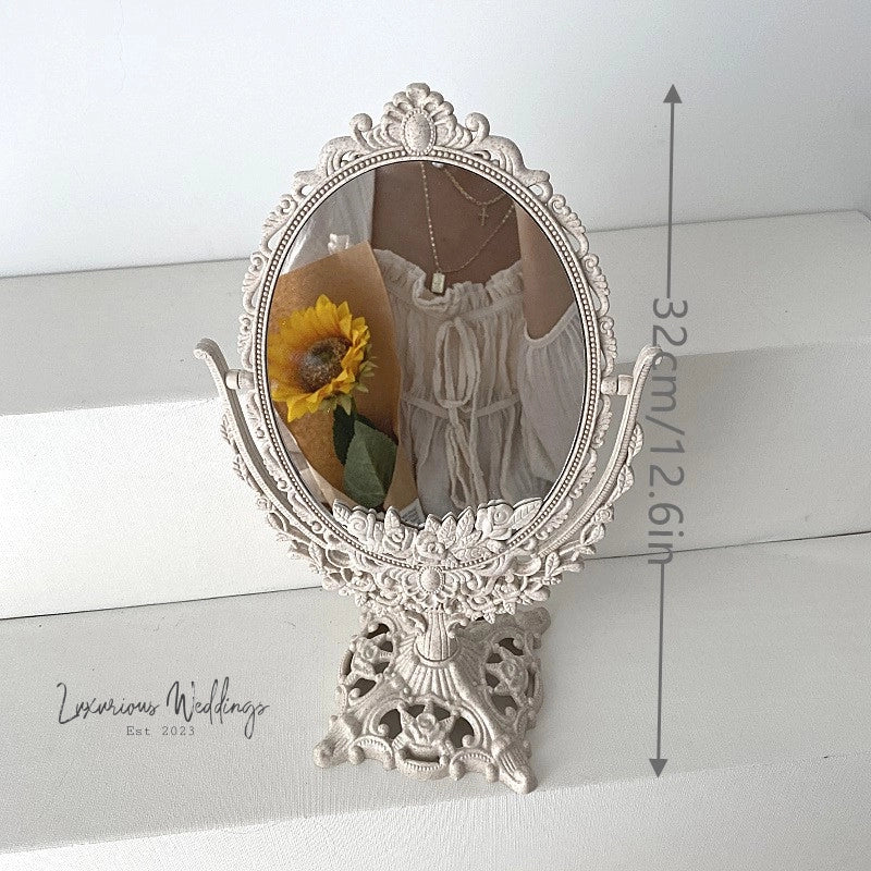 a mirror that has a sunflower in it