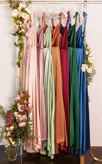 a bunch of dresses hanging on a rack