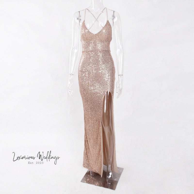 a mannequin dressed in a gold sequin gown