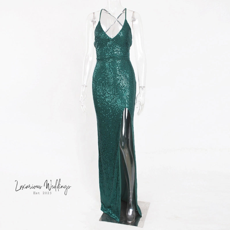 a mannequin dressed in a green sequin gown