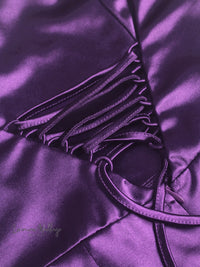 a close up of a purple satin material